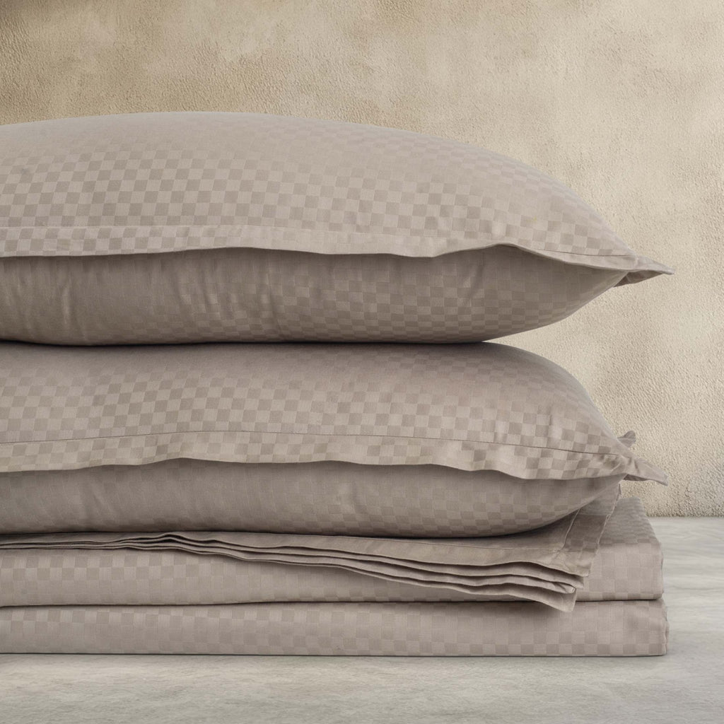 Folded Alhambra clay brown cotton jacquard sateen pillowcases