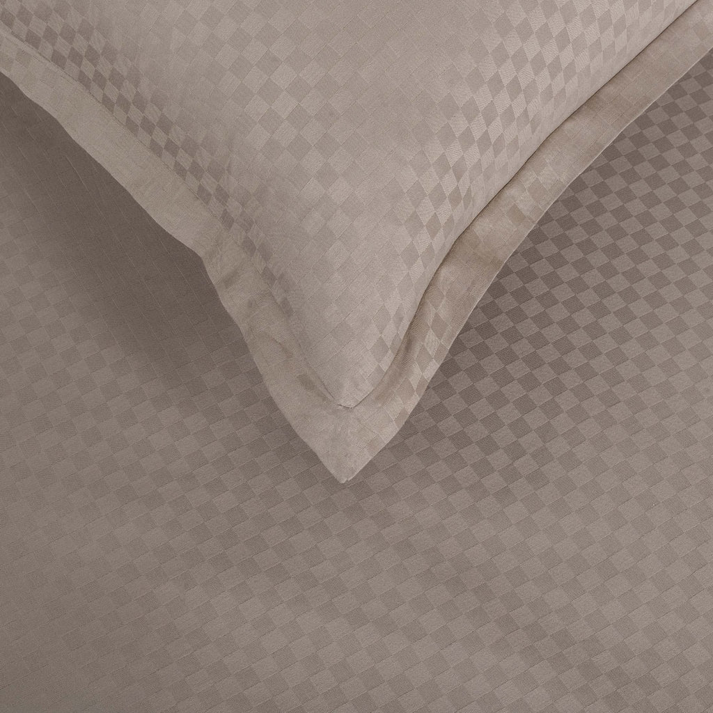 Close-up of Alhambra clay brown Oxford pillowcase with jacquard checkerboard weave