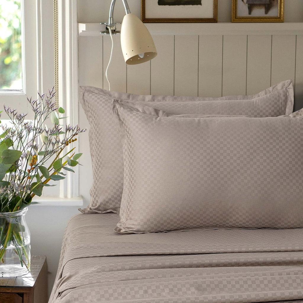 Alhambra clay brown 300 thread count cotton jacquard sateen sheet set styled on a bed