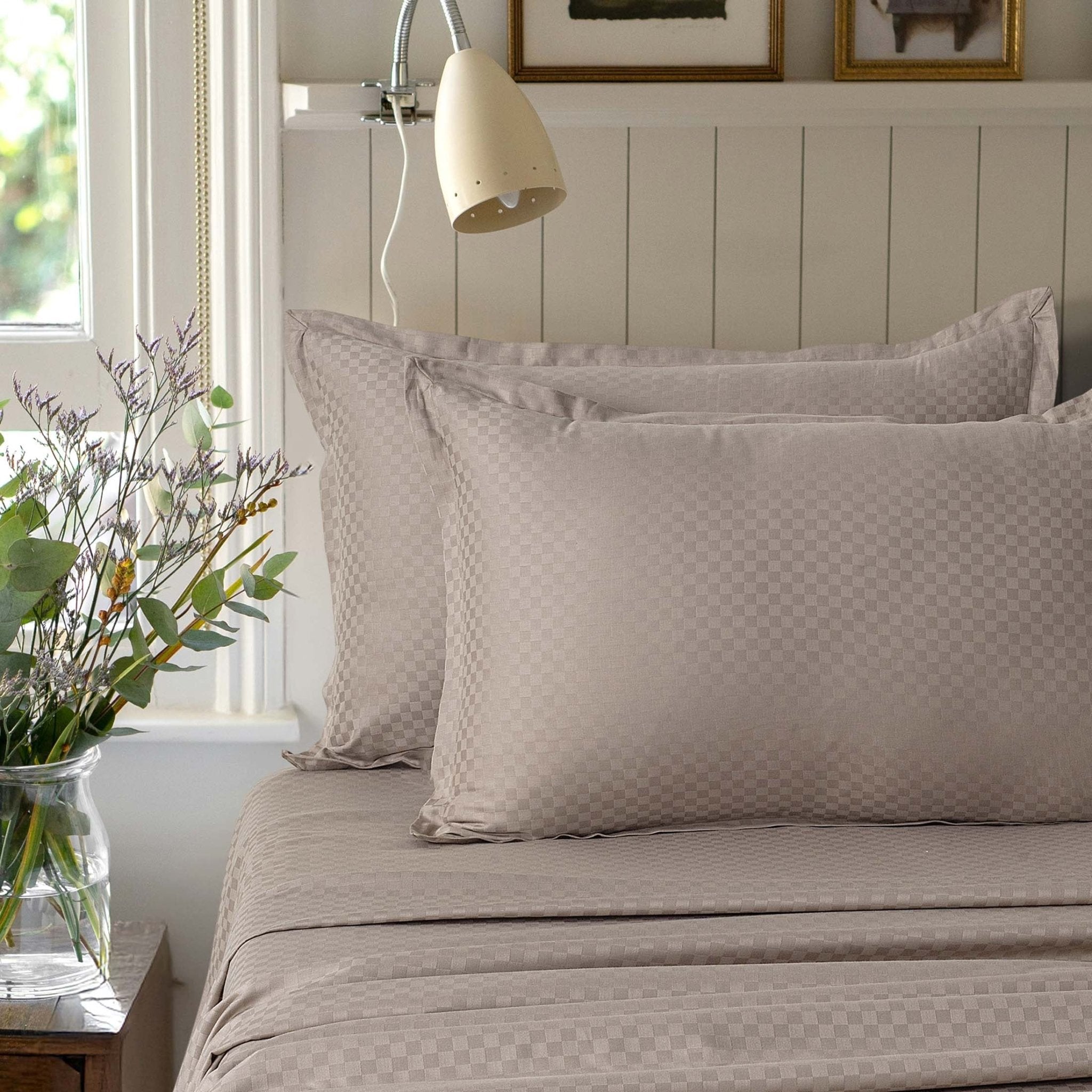 Alhambra clay brown 300 thread count cotton jacquard sateen sheet set styled on a bed
