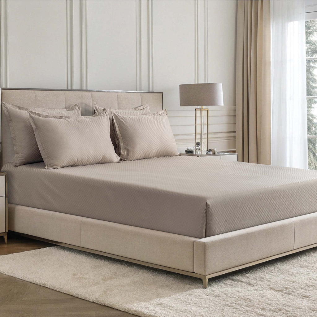 Alhambra clay brown 300 thread count cotton jacquard sateen sheet set on a bed