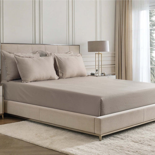 Alhambra clay brown 300 thread count cotton jacquard sateen sheet set on a bed