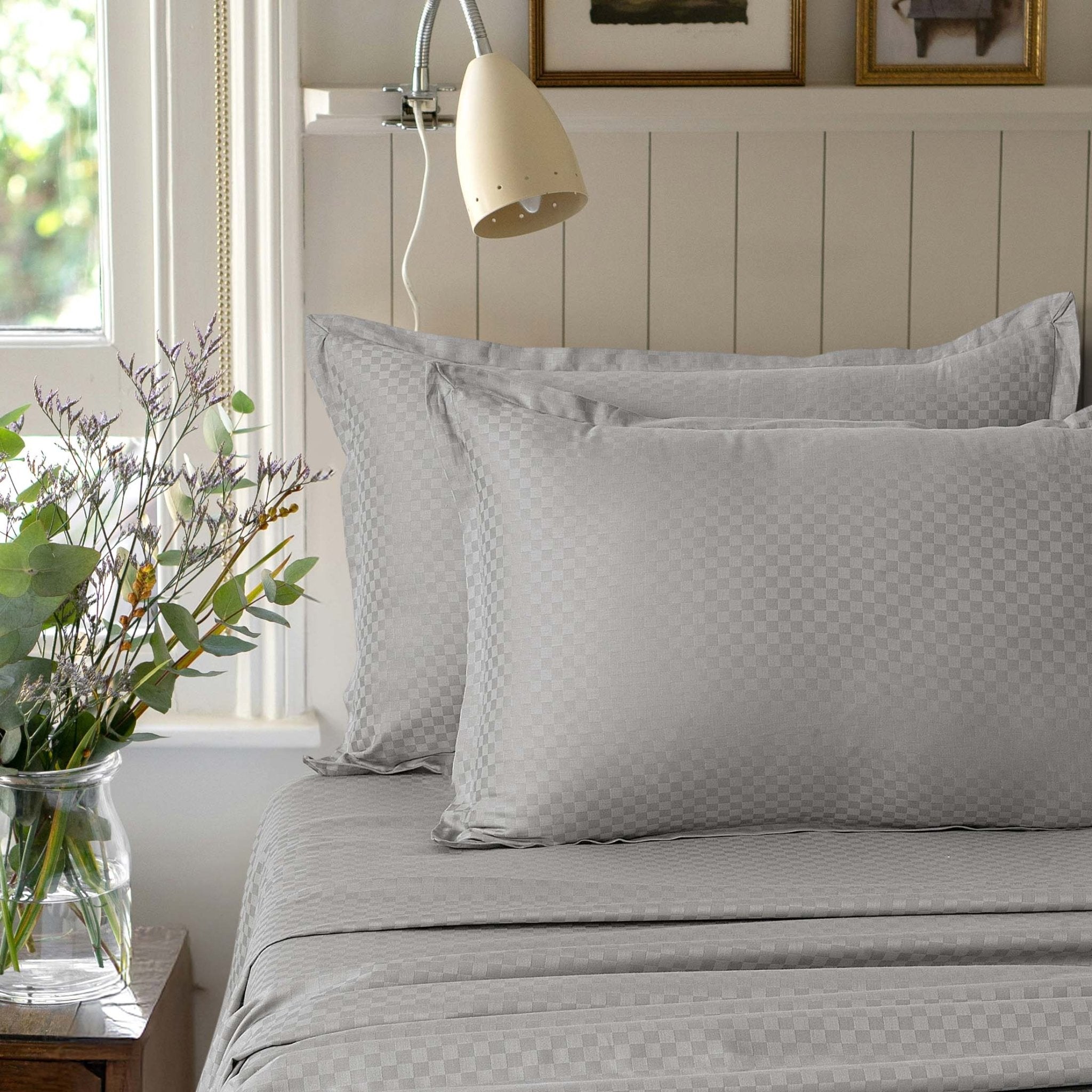 Alhambra stone grey 300 thread count cotton jacquard sateen sheet set styled on a bed