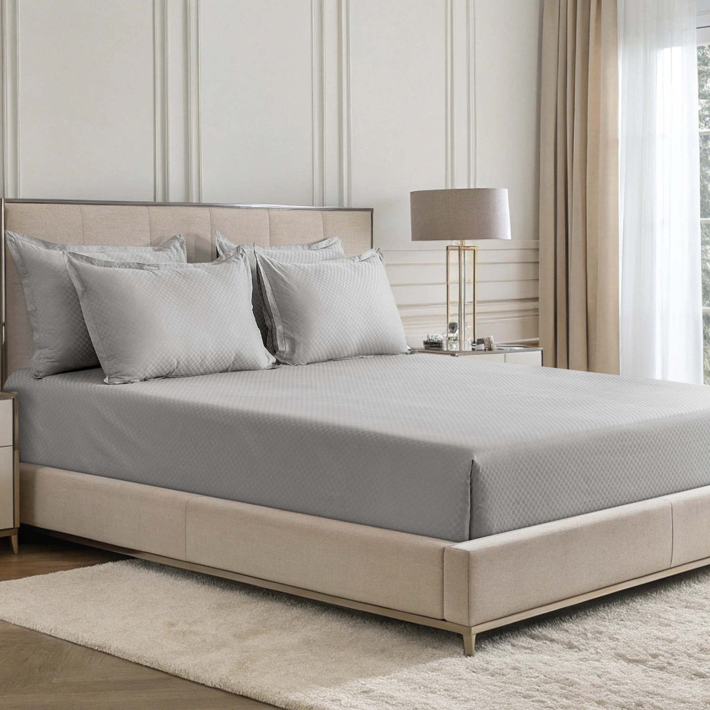 Alhambra stone grey 300 thread count cotton jacquard sateen sheet set on a bed