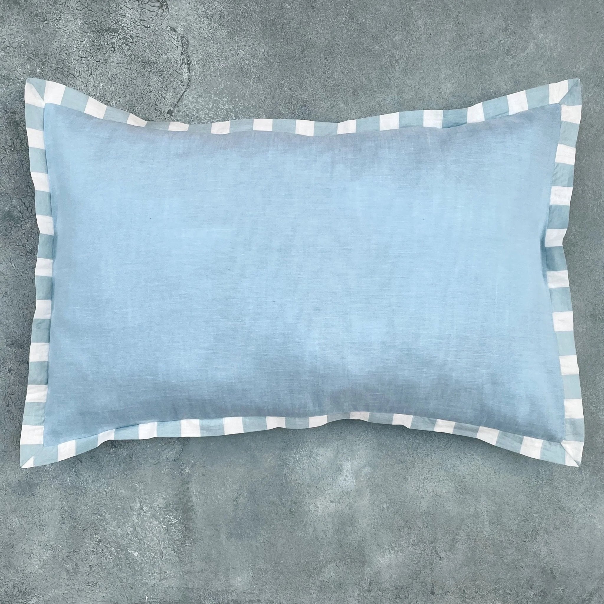 Matching blue cotton cushion cover with white piping