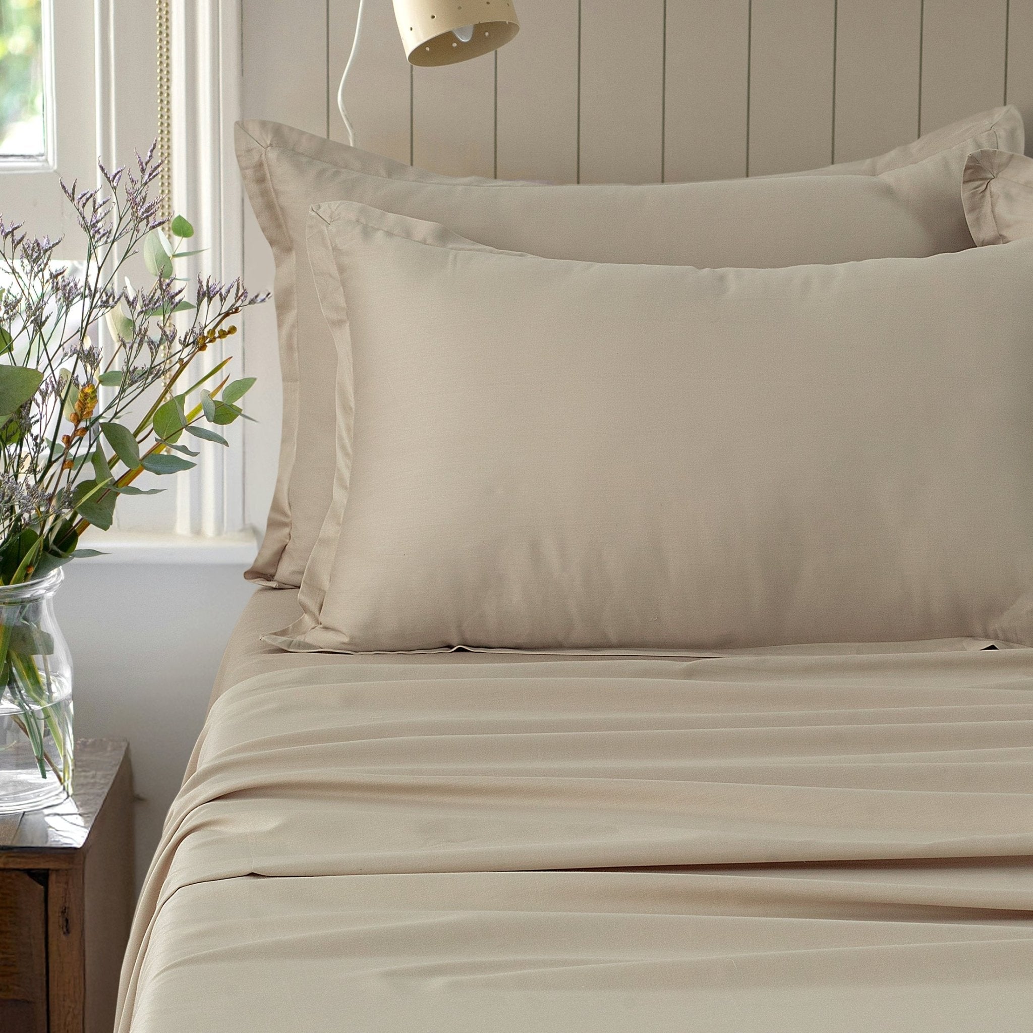 Verona estate beige 300 thread count cotton sateen sheet set styled on a bed