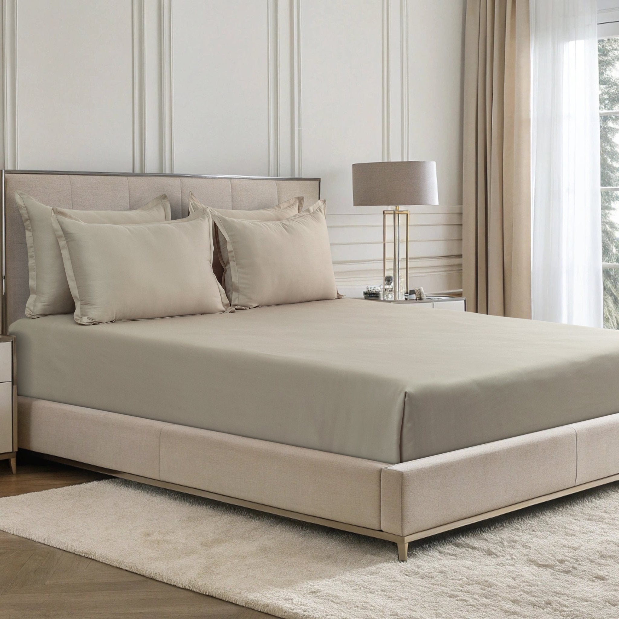 Verona estate beige 300 thread count cotton sateen sheet set styled on a bed with matching pillowcases