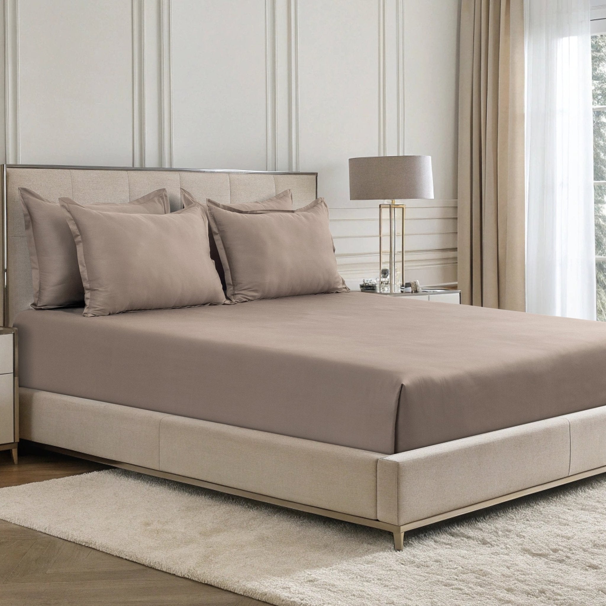 Verona warm taupe 300 thread count cotton sateen sheet set styled on a bed with matching pillowcases