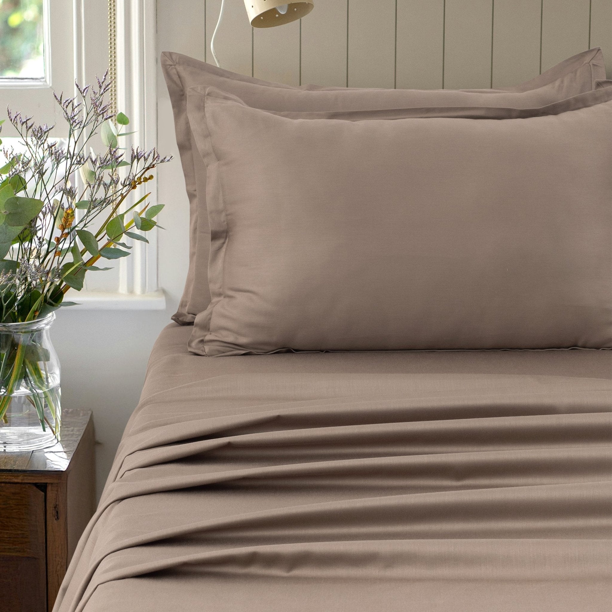 Verona warm taupe 300 thread count cotton sateen sheet set styled on a bed